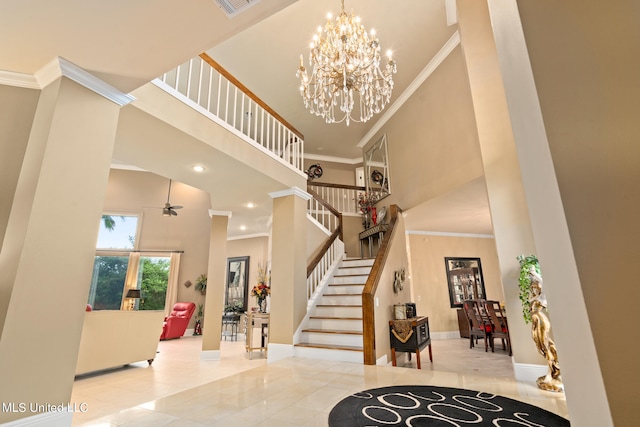 19592 Champion Cir, Gulfport, MS 39503 - entrance foyer featuring a towering ceiling, baseboards, crown molding, stairway, and a chandelier