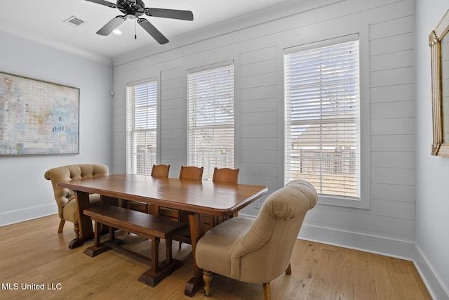 dining area featuring ceiling fan and light wood-type flooring