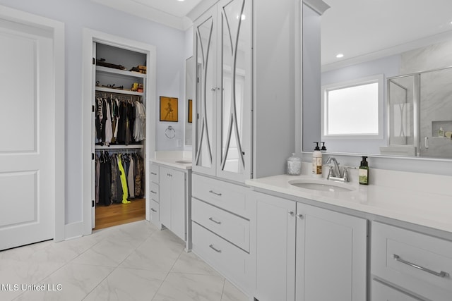 bathroom with walk in shower and vanity