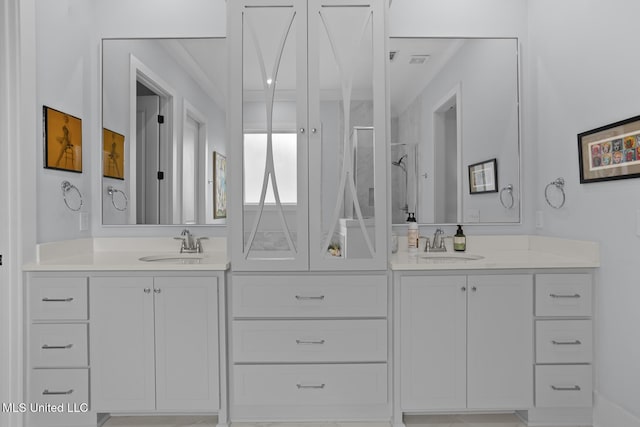 bathroom with vanity and a shower