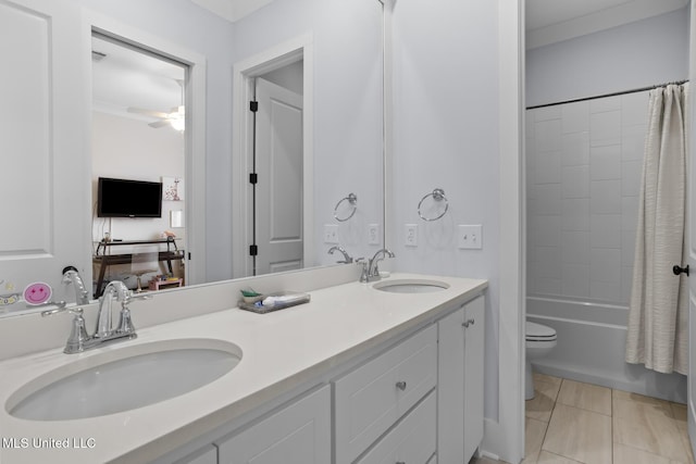 full bathroom featuring ceiling fan, shower / tub combo, vanity, tile patterned floors, and toilet