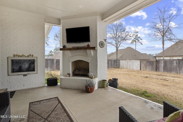 view of patio / terrace with an outdoor brick fireplace