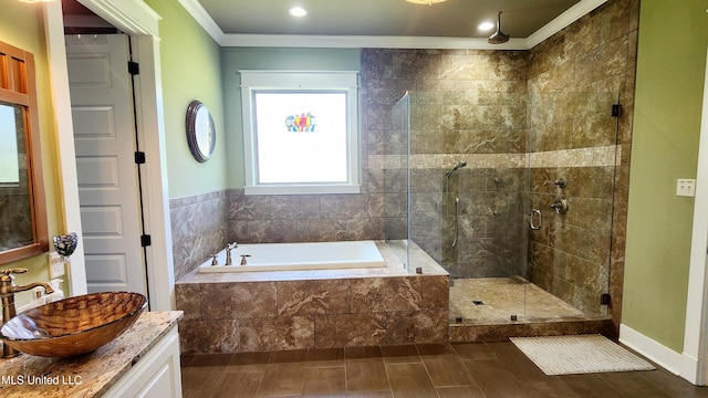 bathroom featuring vanity, crown molding, hardwood / wood-style floors, and plus walk in shower