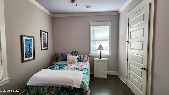 bedroom featuring ornamental molding and dark wood-type flooring