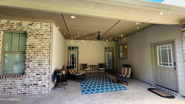 view of patio featuring ceiling fan