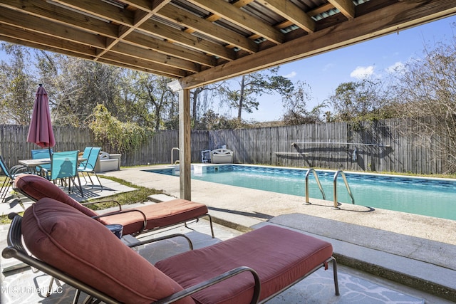 view of swimming pool featuring a patio, a fenced backyard, and a fenced in pool