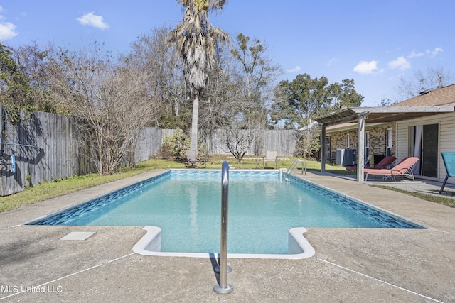 view of pool featuring a fenced backyard, a fenced in pool, central AC, and a patio