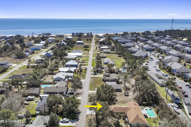 birds eye view of property featuring a water view and a residential view