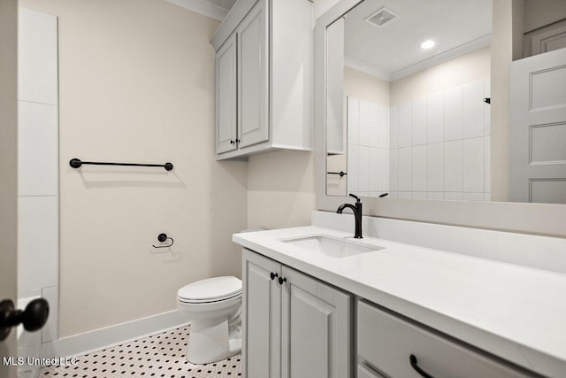 bathroom featuring baseboards, visible vents, toilet, walk in shower, and vanity