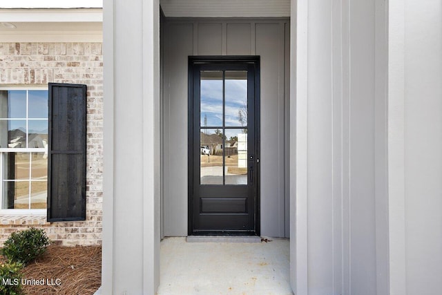 entrance to property with brick siding