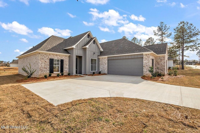 view of front of home featuring a shingled roof, concrete driveway, an attached garage, board and batten siding, and brick siding