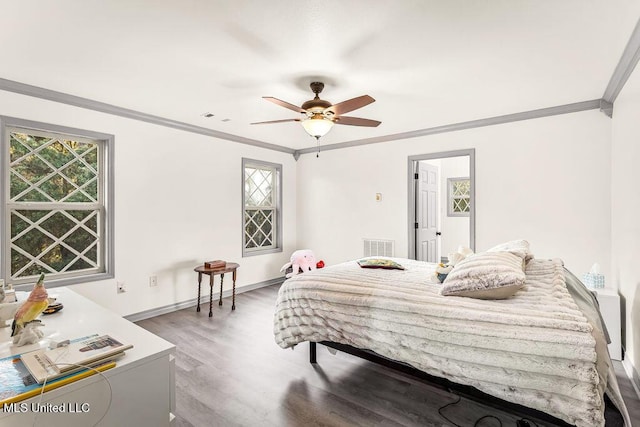 bedroom featuring ceiling fan, ornamental molding, and hardwood / wood-style flooring