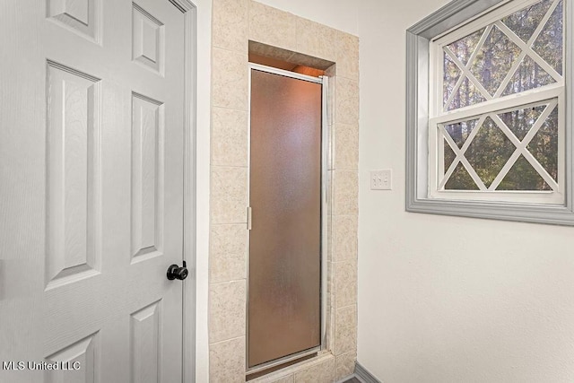 bathroom with an enclosed shower