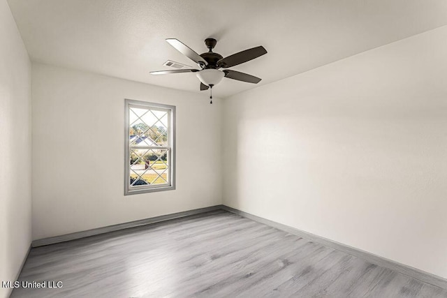 unfurnished room with ceiling fan and light hardwood / wood-style floors