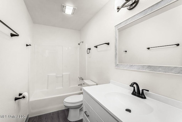 full bathroom with vanity, hardwood / wood-style flooring, toilet, and tub / shower combination