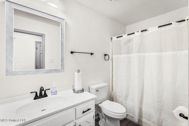 bathroom with vanity and toilet