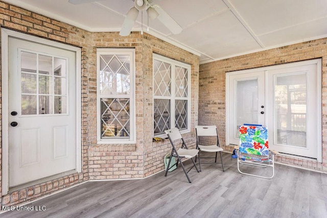 entrance to property featuring ceiling fan