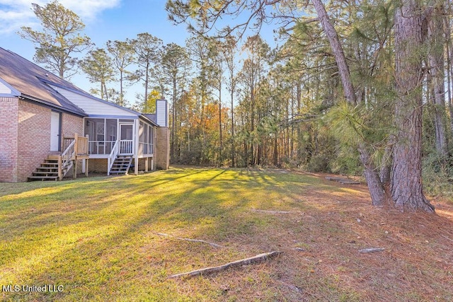 view of yard with a sunroom