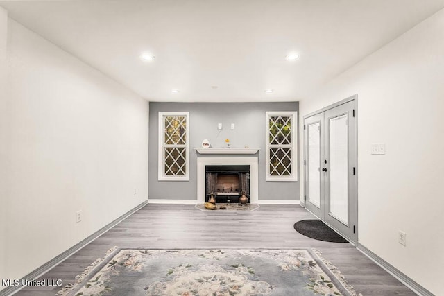 unfurnished living room featuring hardwood / wood-style floors