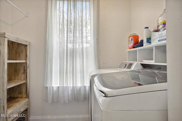 laundry area featuring washing machine and clothes dryer