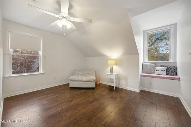 unfurnished room featuring dark hardwood / wood-style flooring, ceiling fan, and lofted ceiling