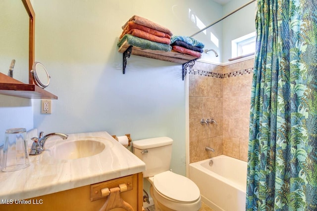 full bath featuring vanity, toilet, and shower / bath combo