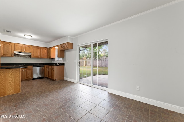kitchen with baseboards, under cabinet range hood, brick patterned floor, and dishwasher
