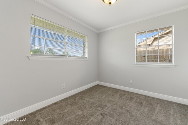 carpeted empty room with baseboards and ornamental molding