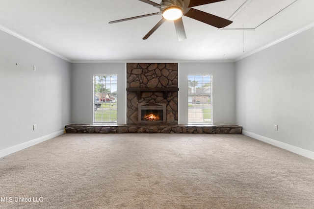 unfurnished living room with baseboards, ornamental molding, carpet, and attic access