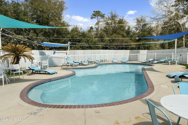 view of pool with a patio area, a fenced in pool, and a fenced backyard