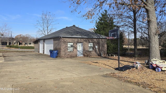 view of side of property with a garage and an outdoor structure