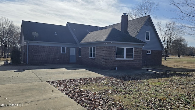 back of property featuring a patio