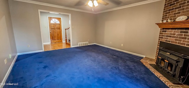 unfurnished living room with carpet, a textured ceiling, ceiling fan, and ornamental molding