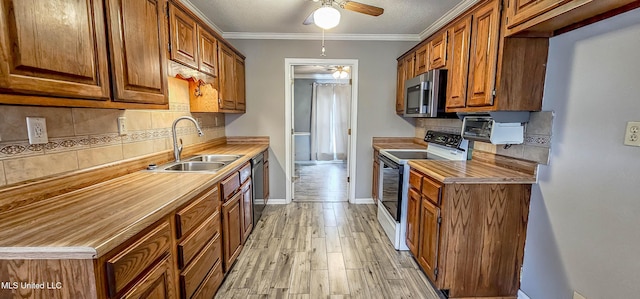 kitchen featuring white range with electric stovetop, dishwasher, sink, and tasteful backsplash