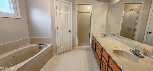 bathroom featuring tile patterned floors, vanity, and plus walk in shower