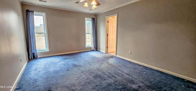 carpeted spare room with ceiling fan, crown molding, and a textured ceiling