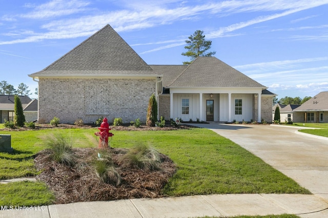 view of front of property with a front yard and a porch