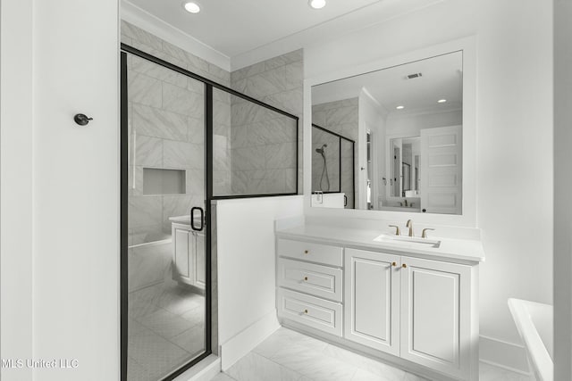 bathroom with vanity and a shower with shower door