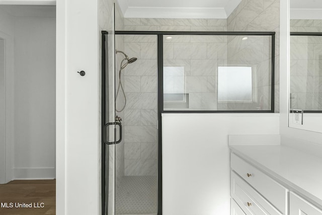 bathroom featuring vanity, an enclosed shower, and wood-type flooring