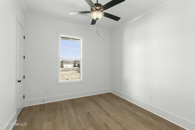 unfurnished room featuring ceiling fan, ornamental molding, and hardwood / wood-style flooring