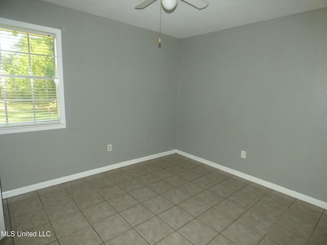 816 Hart Rd, Mccomb, MS 39648 - tiled empty room with baseboards, a healthy amount of sunlight, and ceiling fan