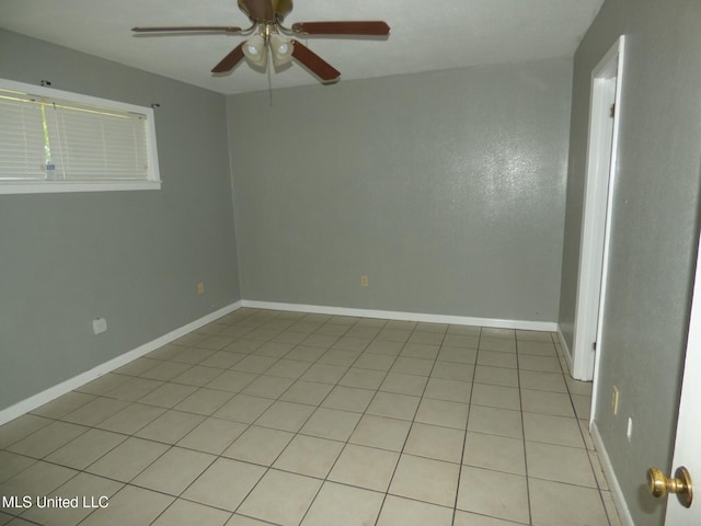 816 Hart Rd, Mccomb, MS 39648 - unfurnished room with baseboards, ceiling fan, and light tile patterned flooring