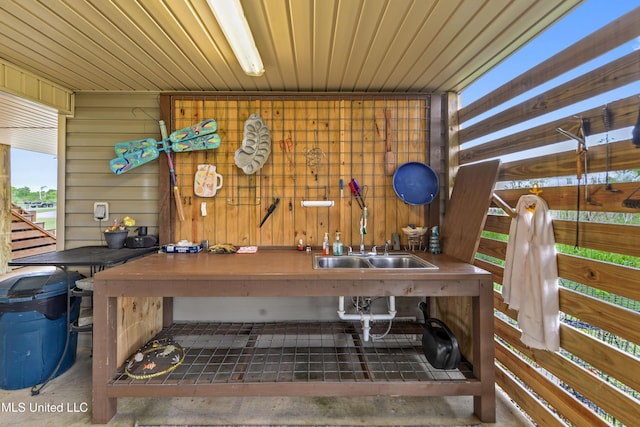 11334 Texas St, Bay Saint Louis, MS 39520 - misc room with a sink and wood walls