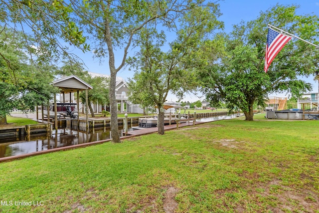 11334 Texas St, Bay Saint Louis, MS 39520 - dock area featuring a water view and a yard