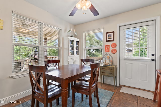 11334 Texas St, Bay Saint Louis, MS 39520 - tiled dining area with ceiling fan and baseboards
