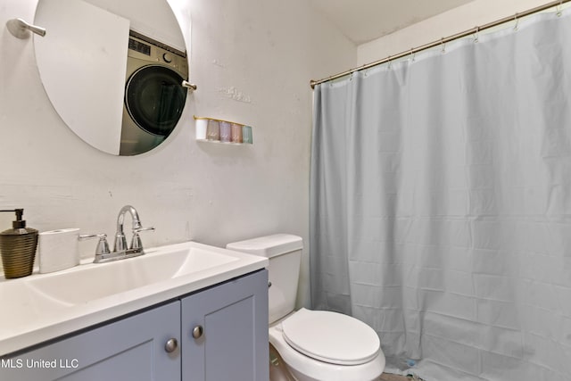 bathroom featuring vanity, toilet, and a shower with curtain