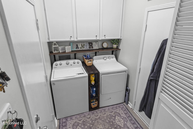 laundry area featuring washer and dryer and cabinet space