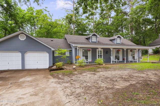 view of front of home with a porch, a shingled roof, driveway, and an attached garage