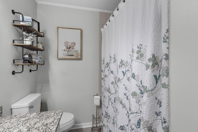 bathroom featuring toilet, ornamental molding, a textured ceiling, baseboards, and curtained shower