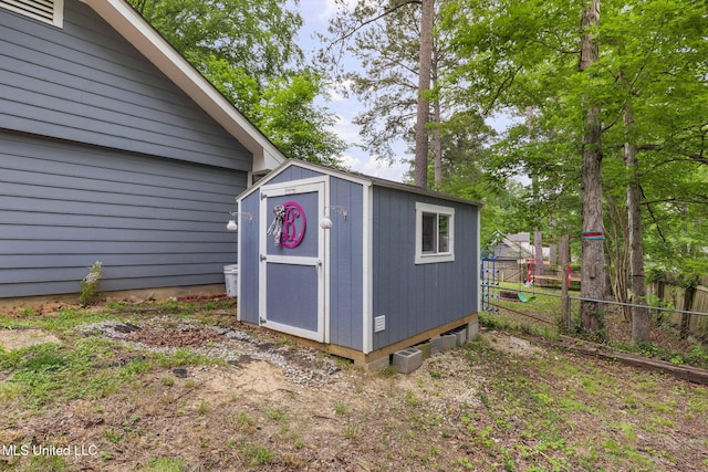 view of shed with fence